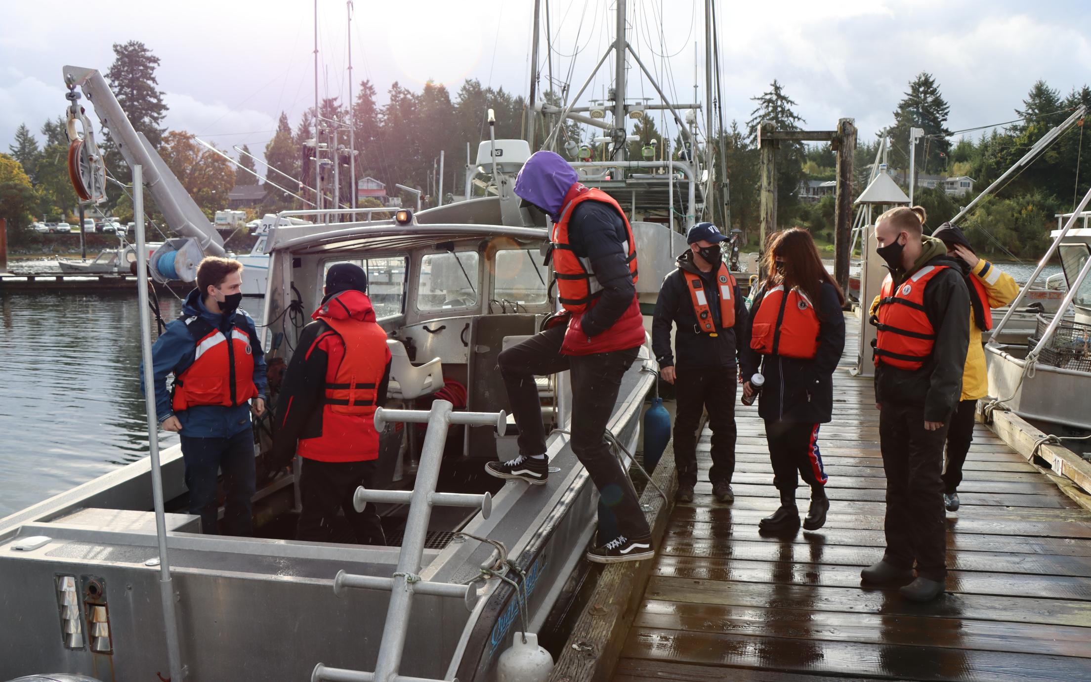 VIU students in front of boat