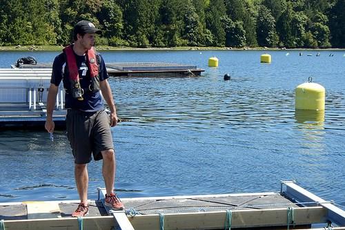 Assembly of NextGen shellfish raft: Summer student Jacob Zimmerman helps with tying new raft into the grid system