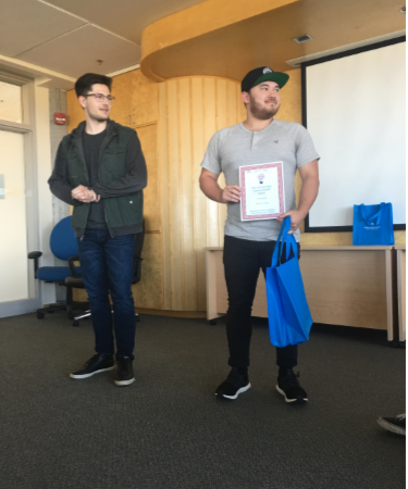 John Meszaros received one of the 2019 Cole Schisler "I give a DAMN award" for his project Give Girls a Choice. Cole Schisler is on the left.